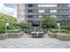 Relax on the expansive stone patio with outdoor seating and a large screen television at 3445 Stratford Rd # 1501, Atlanta, GA 30326