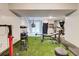 Home gym in basement features turf flooring, punching bag, and fitness equipment at 3861 Hanover Ct, Marietta, GA 30062