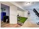 Workout room in the basement featuring astroturf, punching bag, and gym equipment at 3861 Hanover Ct, Marietta, GA 30062