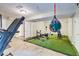 Finished basement featuring a gym setup with a treadmill and weights on the turf at 3861 Hanover Ct, Marietta, GA 30062