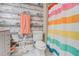 Bright bathroom featuring modern fixtures, marble floors, and a colorful shower curtain at 3861 Hanover Ct, Marietta, GA 30062