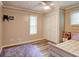 Bedroom with a purple rug, wood floors, and a closet with doors at 3861 Hanover Ct, Marietta, GA 30062