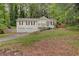 Charming two-story home features a front porch, two-car garage, and a well-maintained lawn at 3861 Hanover Ct, Marietta, GA 30062