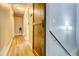 Hallway featuring hardwood floors, neutral walls, and a wooden barn door at 3861 Hanover Ct, Marietta, GA 30062