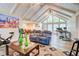 Open-concept living room with vaulted ceilings, a fireplace, and hardwood floors at 3861 Hanover Ct, Marietta, GA 30062