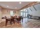 Spacious living area with an open floor plan, hardwood floors, and a beamed, vaulted ceiling at 3861 Hanover Ct, Marietta, GA 30062