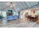 Open-concept living room with vaulted ceilings, a fireplace, and hardwood floors at 3861 Hanover Ct, Marietta, GA 30062