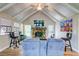 Open-concept living room with vaulted ceilings, a fireplace, and hardwood floors at 3861 Hanover Ct, Marietta, GA 30062