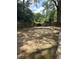 Fenced-in backyard featuring lush green trees and an outdoor dining area at 1055 Worthington Hills Dr, Roswell, GA 30076