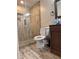 Modern bathroom with glass-enclosed shower, pebble floor, updated vanity, and tile flooring at 1055 Worthington Hills Dr, Roswell, GA 30076
