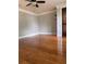 Bedroom showcasing hardwood floors, natural light, and a ceiling fan at 1055 Worthington Hills Dr, Roswell, GA 30076