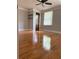 Bright bedroom featuring hardwood floors, natural light, and a ceiling fan at 1055 Worthington Hills Dr, Roswell, GA 30076