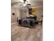 Spacious bedroom features ample natural light, stylish decor and wood-look tile flooring at 1055 Worthington Hills Dr, Roswell, GA 30076