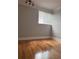 Bedroom showcasing hardwood floors, a window, and natural light at 1055 Worthington Hills Dr, Roswell, GA 30076