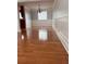 Formal dining room with hardwood floors, new paint, and modern light fixture at 1055 Worthington Hills Dr, Roswell, GA 30076