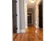 Hallway featuring hardwood floors, neutral paint and doors at 1055 Worthington Hills Dr, Roswell, GA 30076