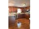Gourmet kitchen featuring granite counters, wooden cabinets, and stainless steel appliances at 1055 Worthington Hills Dr, Roswell, GA 30076