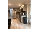 Open concept kitchen with stainless steel appliances, sleek countertops and tile flooring at 1055 Worthington Hills Dr, Roswell, GA 30076