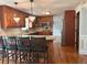Kitchen with granite counters, wooden cabinets, stainless appliances and an island with seating at 1055 Worthington Hills Dr, Roswell, GA 30076