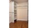 Spacious walk-in closet with custom shelving and hardwood floors for optimal organization at 1055 Worthington Hills Dr, Roswell, GA 30076