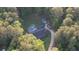 Aerial view of property with in-ground pool, shed and long driveway at 160 Riverbrooke Trl, Covington, GA 30016