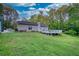 Exterior shot of backyard with a deck and an open view at 160 Riverbrooke Trl, Covington, GA 30016