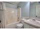 Standard bathroom featuring a tub/shower combo, toilet, patterned flooring, and vanity with a sink at 160 Riverbrooke Trl, Covington, GA 30016