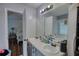 Bathroom features a double sink vanity and a door to the main bedroom at 160 Riverbrooke Trl, Covington, GA 30016