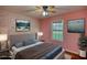 Cozy bedroom with a large bed, soft lighting, and decorative wall art creating a relaxing atmosphere at 160 Riverbrooke Trl, Covington, GA 30016