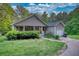 Beautiful single-story home featuring a charming covered porch and well-manicured lawn at 160 Riverbrooke Trl, Covington, GA 30016