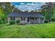 Charming single-story home with a welcoming front porch and a well-maintained lawn surrounded by trees at 160 Riverbrooke Trl, Covington, GA 30016
