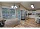 Bright kitchen with stainless appliances, laminate flooring, and a view to the outdoor deck at 160 Riverbrooke Trl, Covington, GA 30016