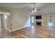 Living room featuring a stone fireplace, hardwood flooring, and neutral walls at 160 Riverbrooke Trl, Covington, GA 30016