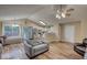 Open-concept living room with vaulted ceiling, hardwood floors, and kitchen view at 160 Riverbrooke Trl, Covington, GA 30016