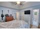 Main bedroom with TV, ceiling fan and en suite bathroom at 160 Riverbrooke Trl, Covington, GA 30016