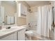 Bright bathroom featuring a shower-tub combo, white vanity, and a mirrored wall cabinet at 1928 Stancrest Nw Trce, Kennesaw, GA 30152