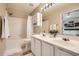 The bathroom offers a double vanity, tiled shower, and modern fixtures at 1928 Stancrest Nw Trce, Kennesaw, GA 30152