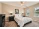 Cozy bedroom featuring neutral walls, plush carpeting, and a comfy queen-sized bed at 1928 Stancrest Nw Trce, Kennesaw, GA 30152