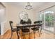 Cozy dining room with hardwood floors, slider to a patio, and stylish pendant lighting at 1928 Stancrest Nw Trce, Kennesaw, GA 30152