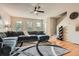 Cozy living room with hardwood floors, ceiling fan, and comfortable seating area at 1928 Stancrest Nw Trce, Kennesaw, GA 30152