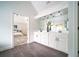 Bathroom featuring a large vanity with double sinks and access to main bedroom at 21 Whitegrass Way, Grayson, GA 30017