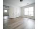 Well-lit bedroom offers generous closet space, neutral paint, and durable flooring at 21 Whitegrass Way, Grayson, GA 30017