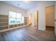 Bright bedroom features built-in bookshelves, window seat, and ensuite bathroom access at 21 Whitegrass Way, Grayson, GA 30017