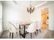 Elegant dining room featuring a modern chandelier and comfortable seating for six at 21 Whitegrass Way, Grayson, GA 30017