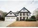 Stunning two-story home featuring a welcoming porch and a two-car garage at 21 Whitegrass Way, Grayson, GA 30017