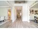 Bright foyer with wood floors leading into the house's various rooms and open spaces at 21 Whitegrass Way, Grayson, GA 30017