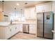 Modern kitchen features stainless steel appliances, granite countertops and hardwood floors at 21 Whitegrass Way, Grayson, GA 30017