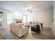 Spacious living room with neutral tones, a cozy fireplace, and ample natural light at 21 Whitegrass Way, Grayson, GA 30017