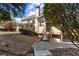 Exterior view of backyard featuring a walkway leading to the deck and patio at 300 Morganshire Pl, Atlanta, GA 30350