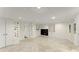 Spacious basement with recessed lighting, tile floors, and access to utility room and storage at 300 Morganshire Pl, Atlanta, GA 30350